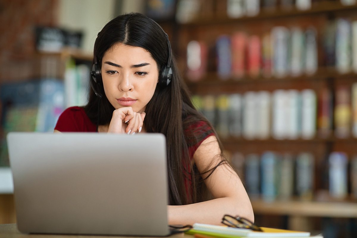 Woman working through an e-learning course on a laptop - ELT and e-learning audio production