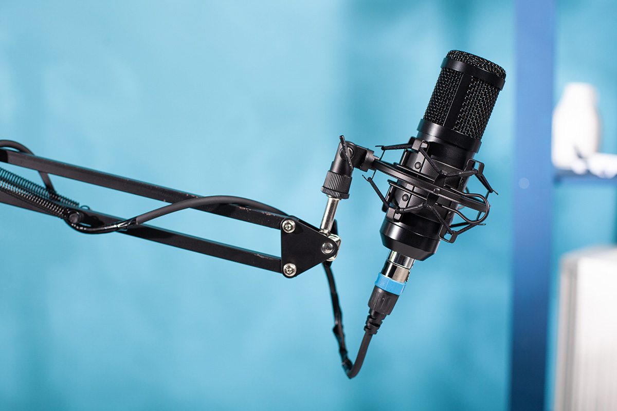 Microphone in a blue studio - Voiceovers and audio production